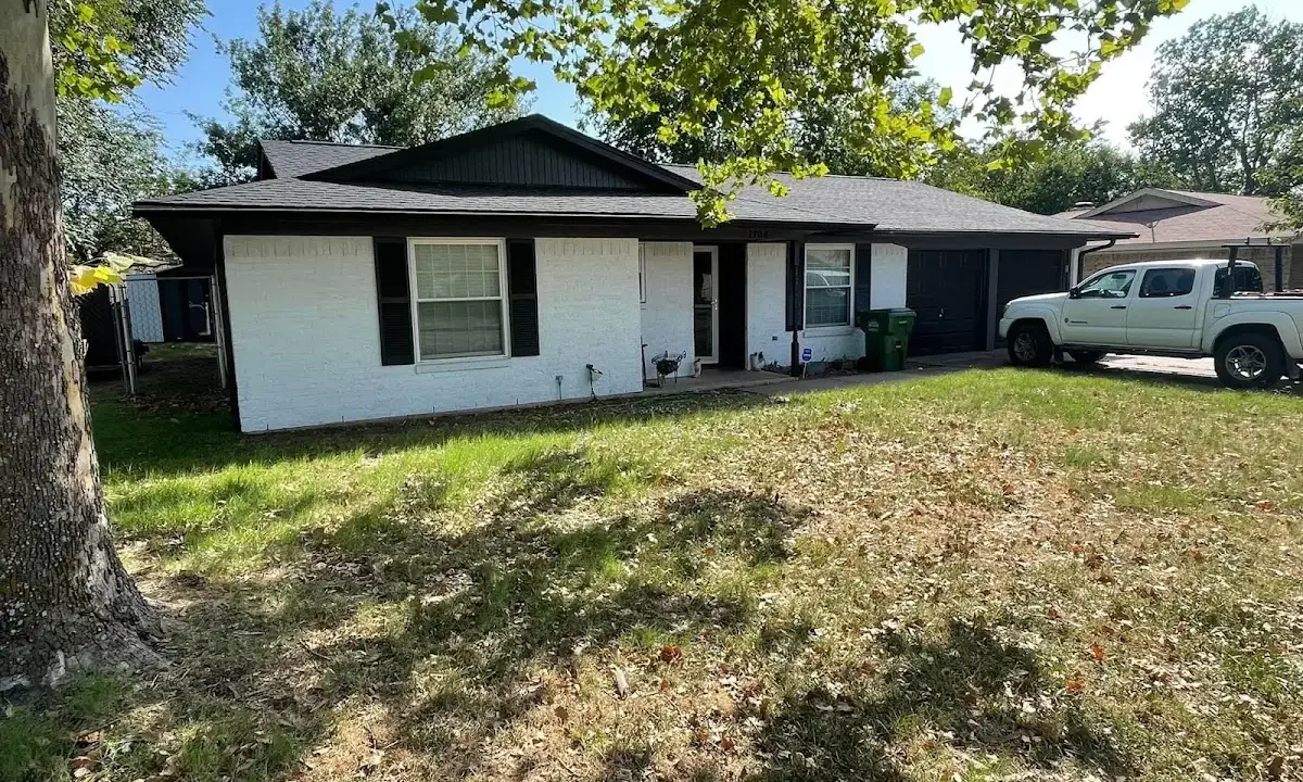 Professional roofing crew working on a residential roof in Westphalia